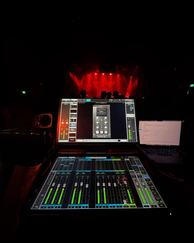 FOH console with red stage lights
